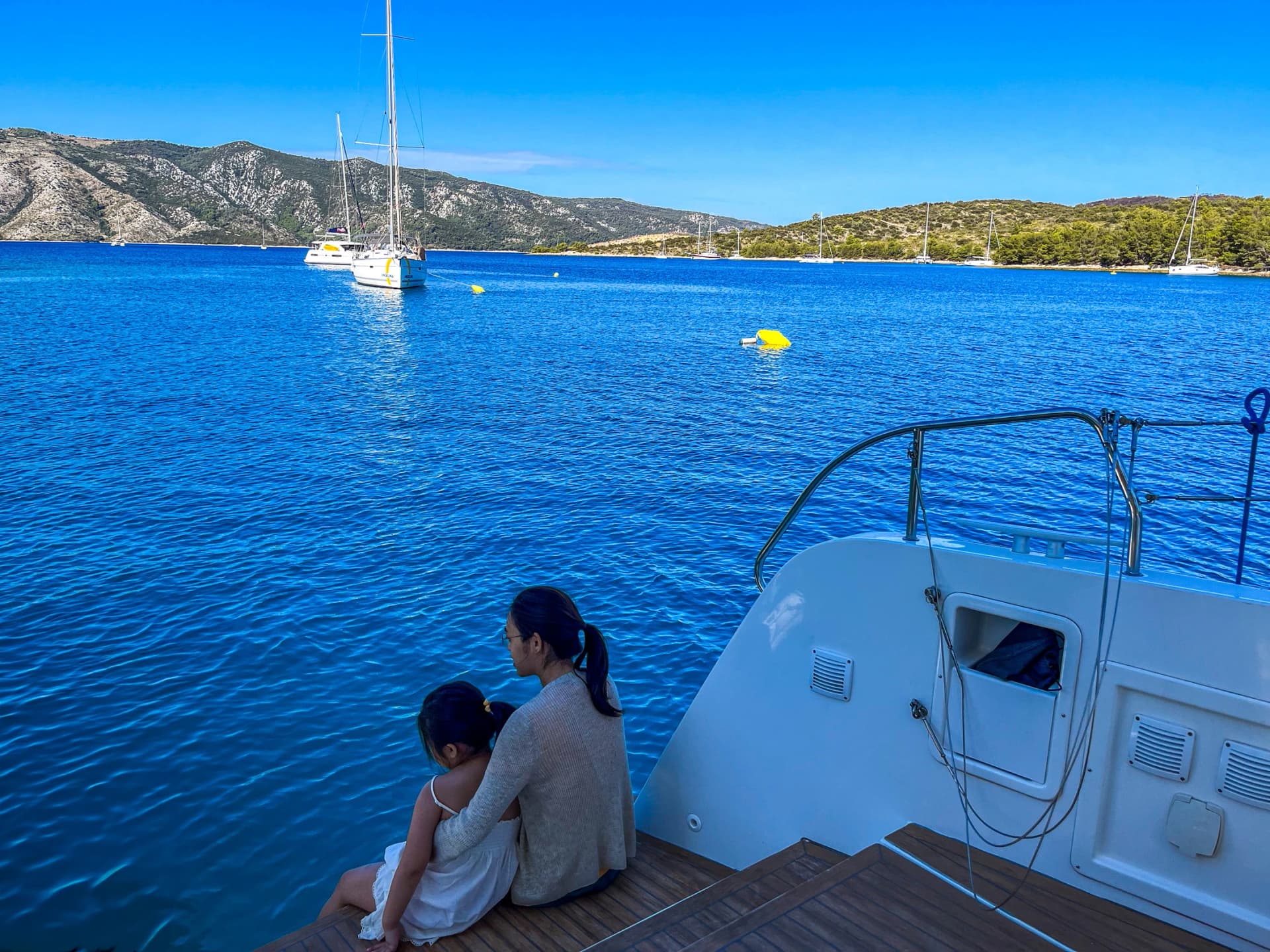 Mother and Daughter Embrace on a Yacht in Croatia