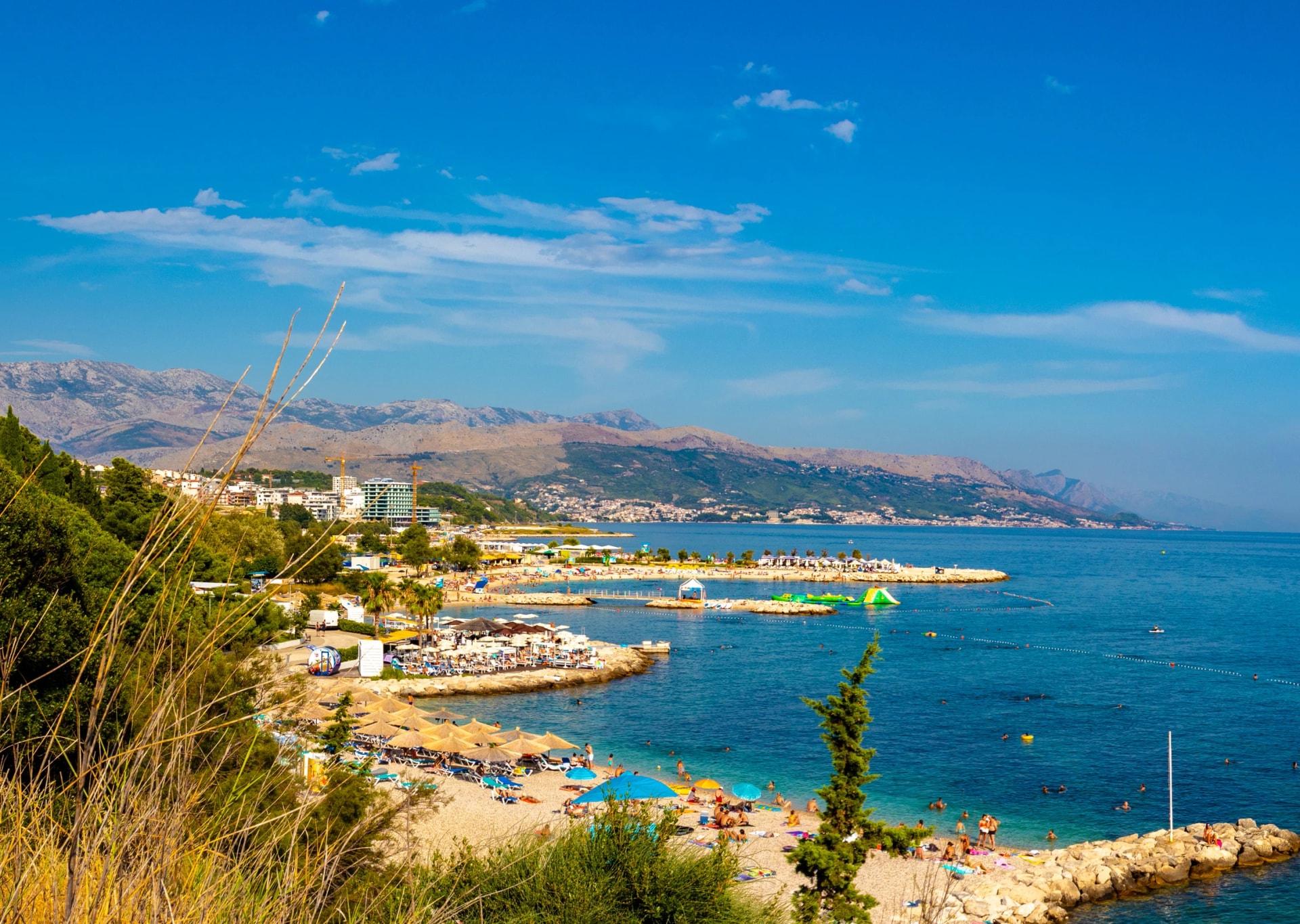 Popular turist beach trstenik znjan, summer people swimming having fun