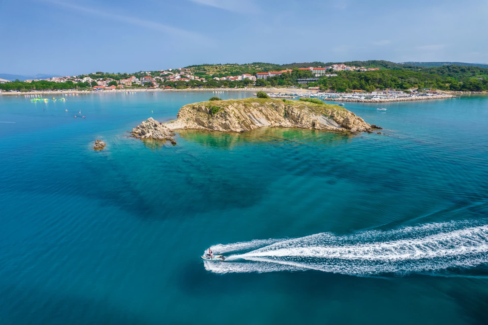 Aerial view of jet ski watercraft cruising in high speed in Adriatic Sea