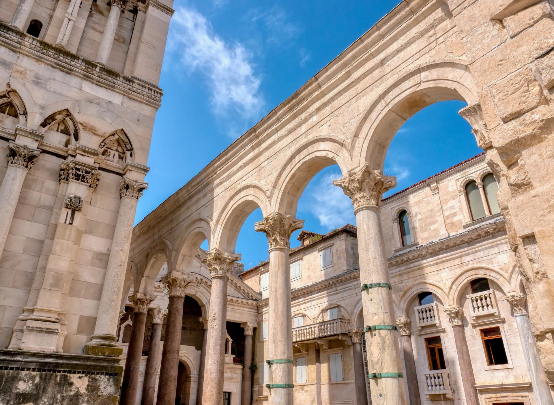 The landmark ancient Roman columns and arches of the central courtyard, called the Peristyle, in Diocletian's Palace, located in the Old Town of Split, Croatia