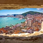 Split bay aerial view through stone window